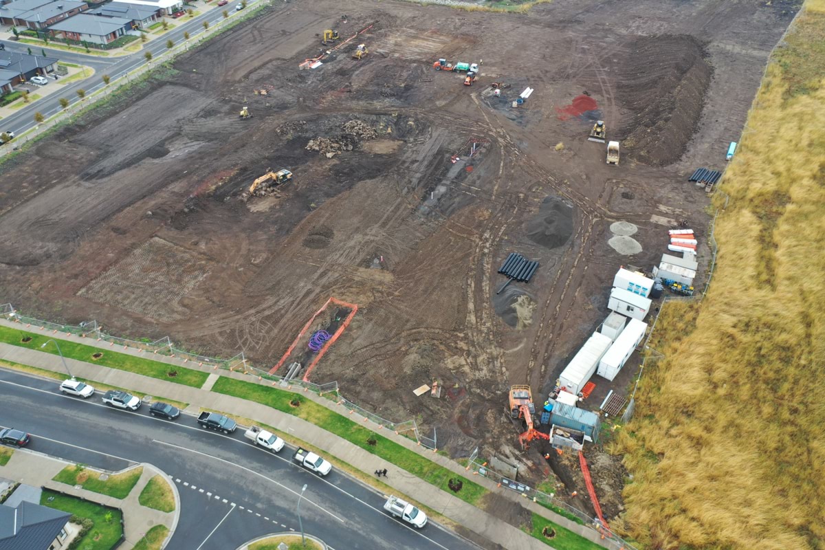 Lockerbie Central Primary School (interim name) - construction photo of site progress in January 2023 - aerial shot of site showing portables and surrounding road access.