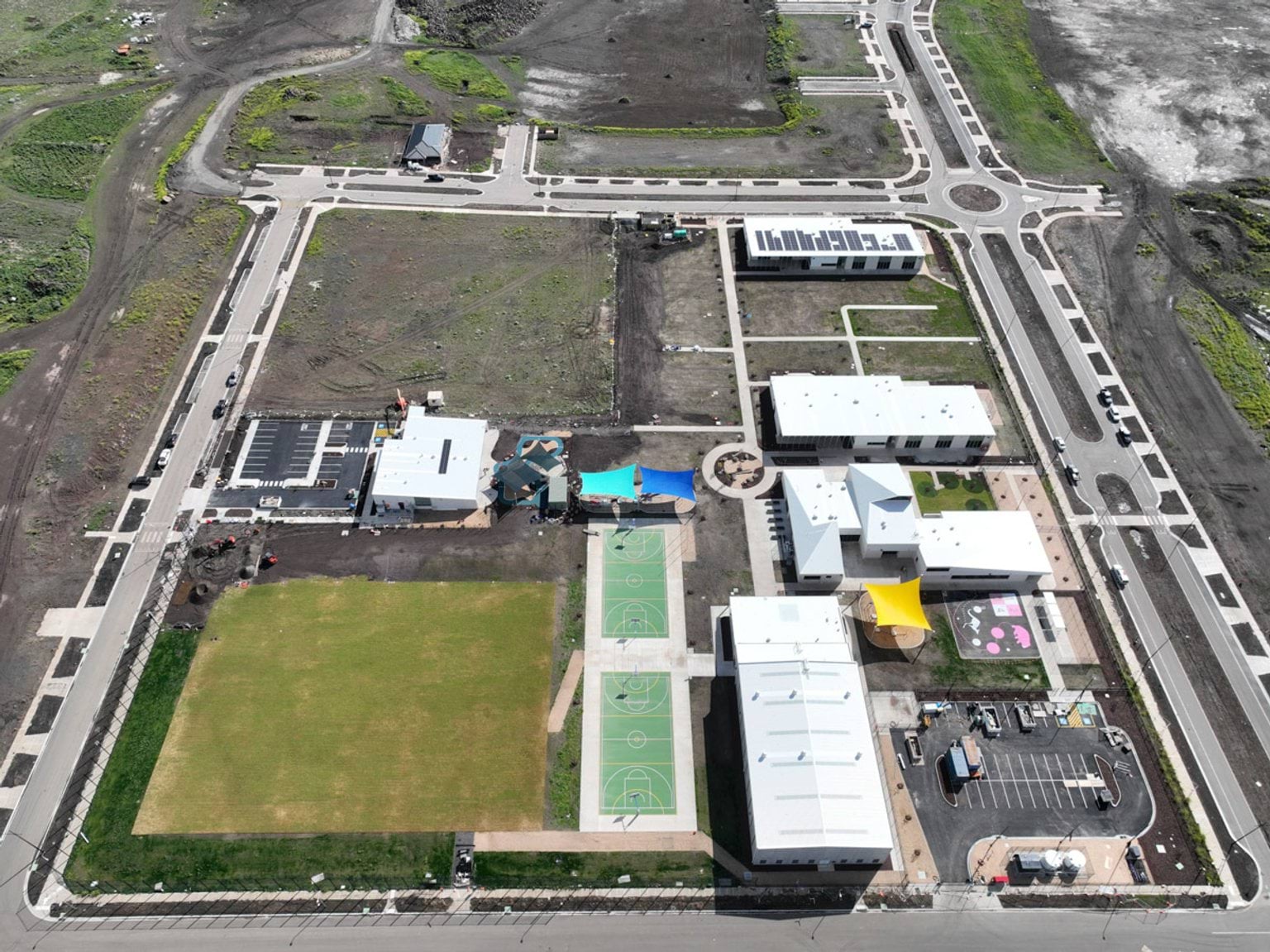 Aerial view of the Muyan Primary and Kindergarten site. Buildings are situated and ovals are in the process of construction
