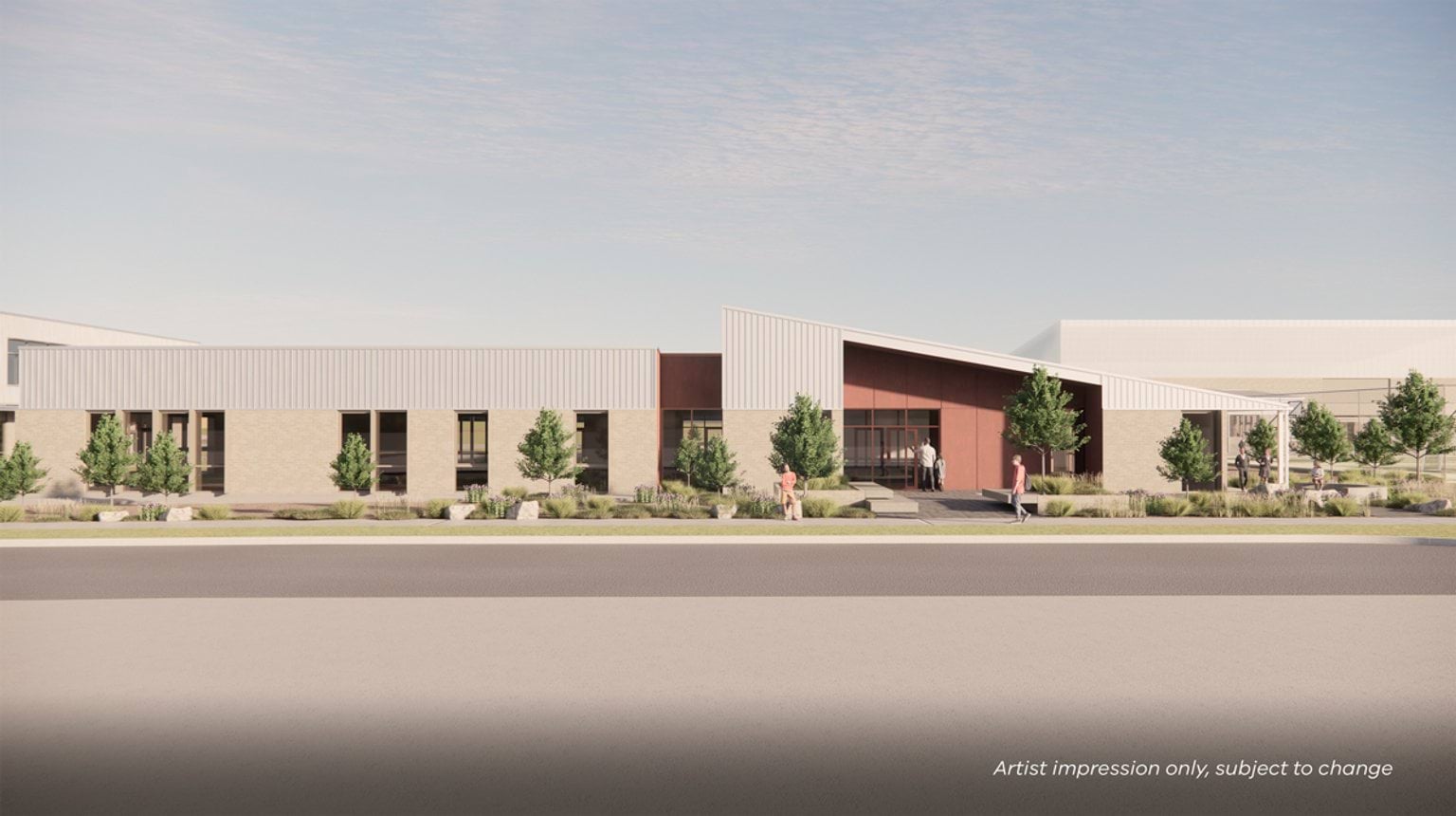 Render of school entrance. There is an entry door in a red feature wall that is part of a white school building. In front of it, there's a footpath and a road.